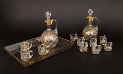 null Blown glass liquor service with gold decoration of flowered and foliated scrolls...