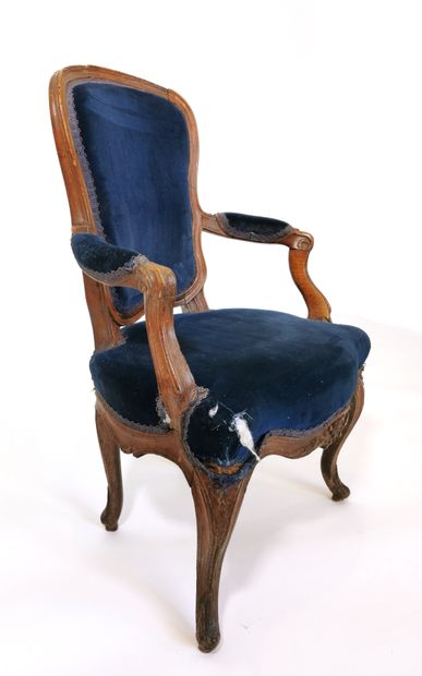 null Armchair with a high cabriolet back in molded and carved beech wood; whiplash...