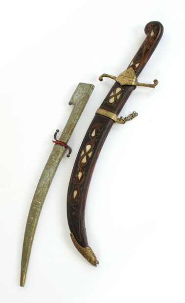 null NORTH AFRICA, first half of the 20th century
Two daggers, one in wood with copper...