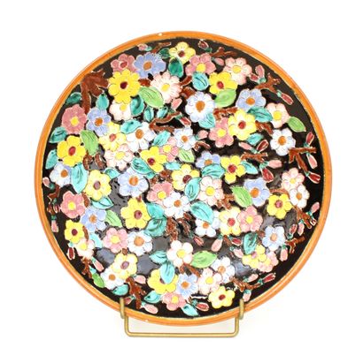 null MODERN WORK, circa 1960
Earthenware dish decorated with flowers signed in hollow...