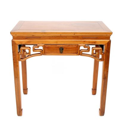 null CHINA, varnished wood console, the front decorated with a stylized frieze framing...