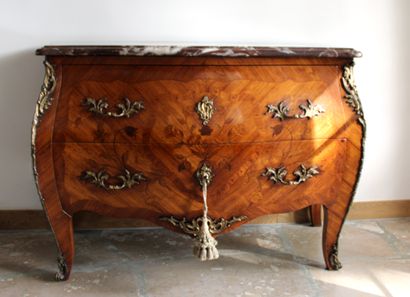 null Louis XV style curved chest of drawers opening to two drawers without crossbar...