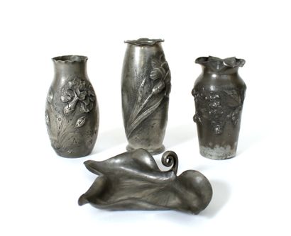 null Art Nouveau work
Suite of three small pewter vases with repoussé decoration...