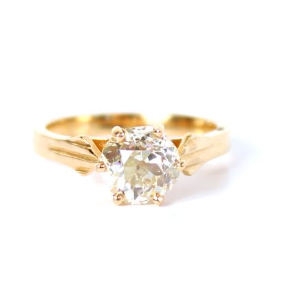 null Solitaire in 18K (750 thousandths) yellow gold, set with a round old-cut diamond...