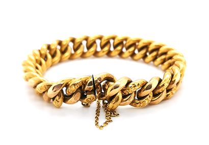 null Flexible, articulated bracelet in 18K (750 thousandths) yellow gold with curb...