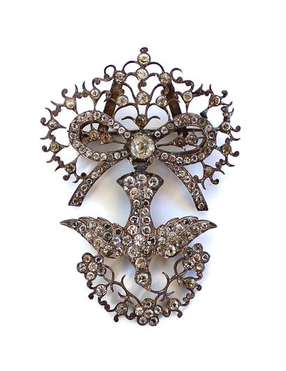 null Saint Esprit brooch in 800 thousandths silver, adorned with a ribboned bow holding...
