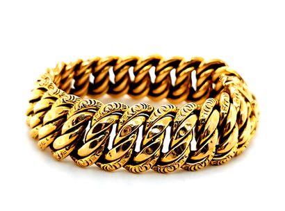 null Bracelet souple en or jaune 18K (750 millièmes) à maille américaine et ciselée,...