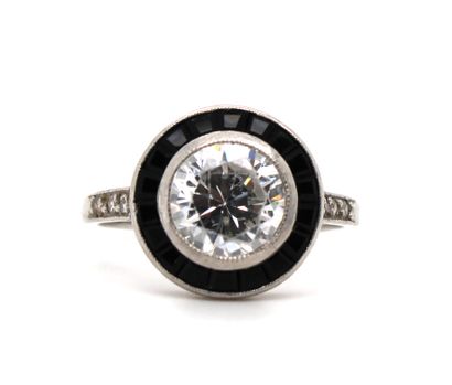 null Ring in platinum (850 thousandths), the circular bezel set with a zircon in...