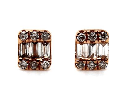 null Pair of 18K (750 thousandths) rose gold earrings, set with three baguette diamonds...