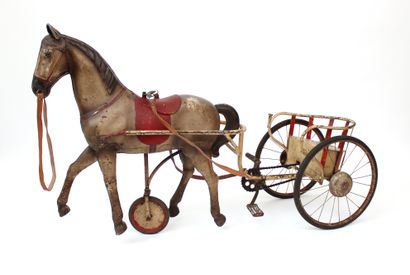 null Pedal horse sulky 50's
Painted sheet metal, welded iron and leather straps
L....