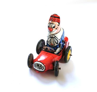 null Mechanical toy, the clown BIMBO on his racing car, JOUSTRA
H. 9 cm
