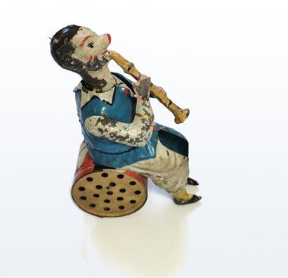 null German mechanical toy featuring a clarinet clown on a bass drum, musical mechanism...
