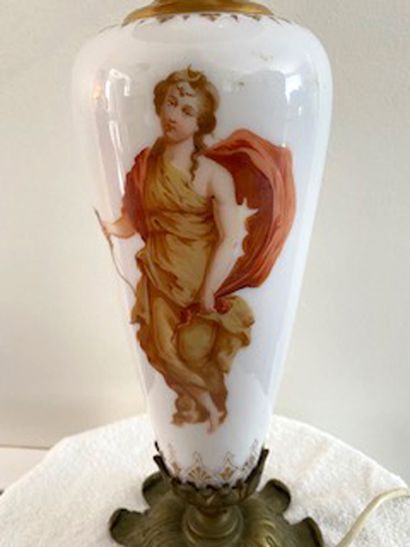 null 
Porcelain and brass baluster lamp with cupid decoration. 

European electric...