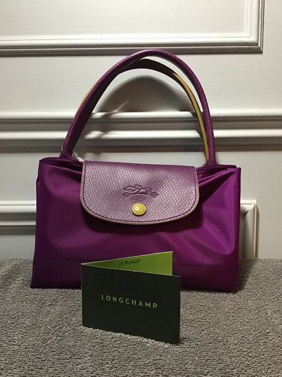 LONGCHAMP 
Purple "folding collection" tote bag, hand-carried, medium size. 

Brand...