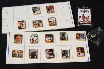 null BEATLES 
16 pins featuring the band. 
A key ring is included. 
Authentic promotional...