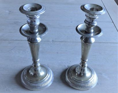 null Pair of candlesticks, model with double bobèches, in silvery metal in the Louis...