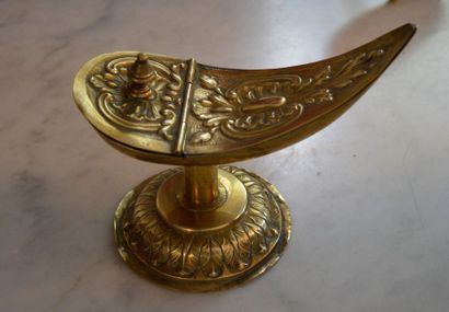null Incense shuttle in embossed brass with decorations of leafy cartridges and frieze...
