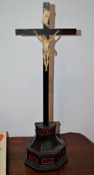 null Ivory crucifix on an ebony cross resting on an ebony and tortoiseshell base...