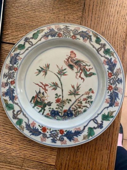 null Chinese porcelain plate with polychrome decorations of phoenix and chimera....