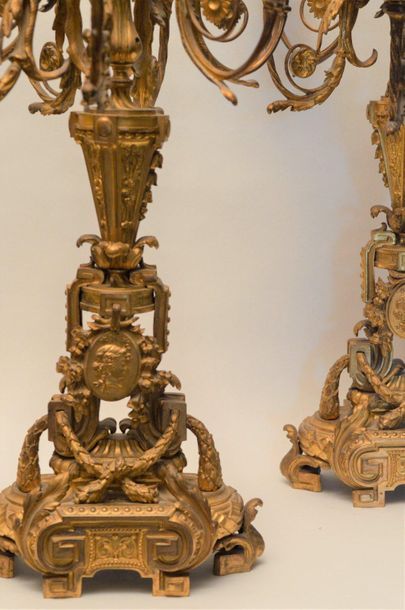 null Pair of seven-armed gilt bronze candelabra with Neoclassical decoration. They...