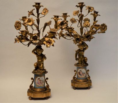 null Pair of gilt bronze candelabra, with five arms of light decorated with fleurs-de-lis...