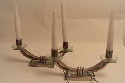 null In the taste of Jacques Adnet. Pair of crossbow candleholders with two arms...
