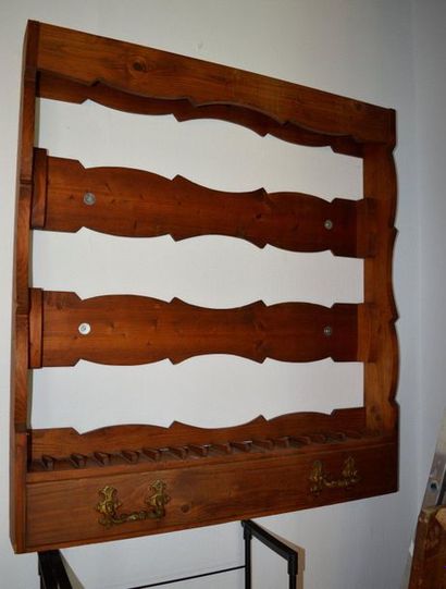 null Rifle rack in natural wood opening by drawer in the lower part. 20th century...