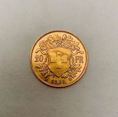 null A 1935 Swiss gold 20 Francs coin. Weight 6.5 grams. BSC.