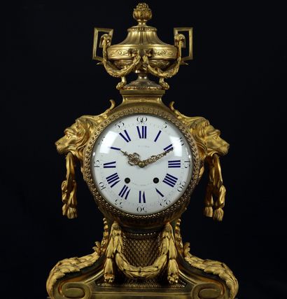 null 
Louis XVI style gilded and chiseled bronze mantel set composed of a clock flanked...