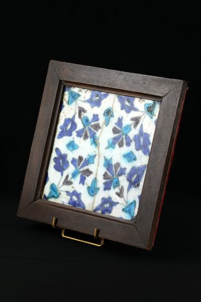 Earthenware tile with foliage decoration....
