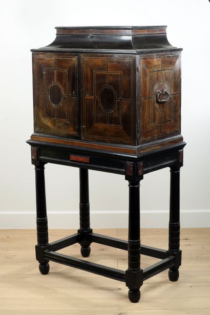 null 
Small cabinet in amaranth veneer with geometrical decoration, framed with brass...