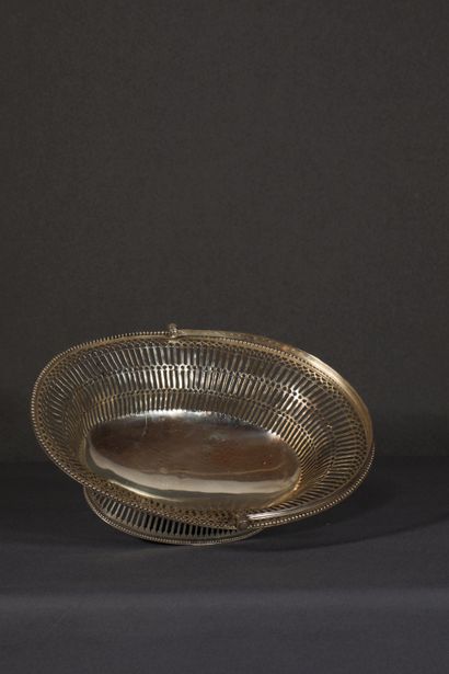 null Silver fruit basket. Oval shaped model resting on a pedestal edged with pearls....