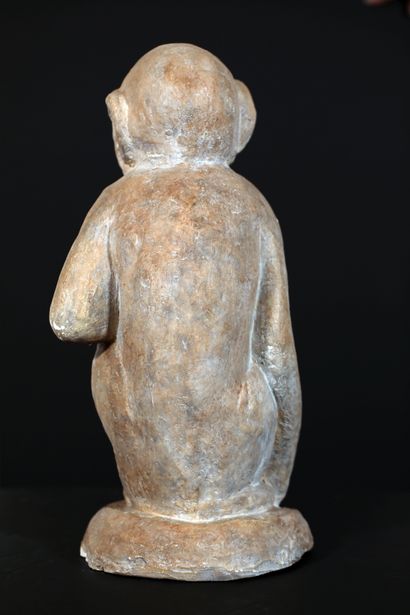 null 
Sculpture in terracotta with white/grey patina representing a sitting monkey...