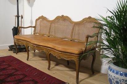 null 
Three seater sofa in natural wood, moulded and carved with flowers, beige rechampi....