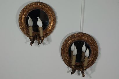 null 
Pair of sconces with two lights. They consist of a round mirror with gilded...