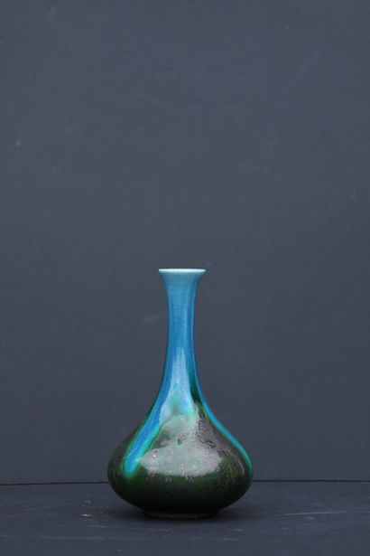 null 
Iridescent ceramic vase with a belly and long neck. Work from the 60s. H: ...
