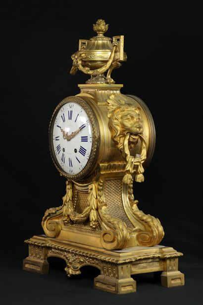 null 
Louis XVI style gilded and chiseled bronze mantel set composed of a clock flanked...