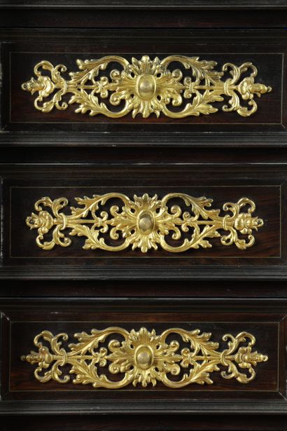 null 
Small cabinet in amaranth veneer with geometrical decoration, framed with brass...