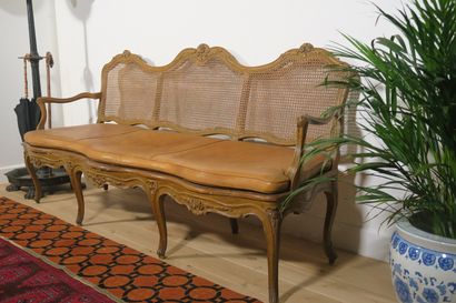 null 
Three seater sofa in natural wood, moulded and carved with flowers, beige rechampi....