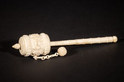 Ivory prayer wheel carved with a revolving...