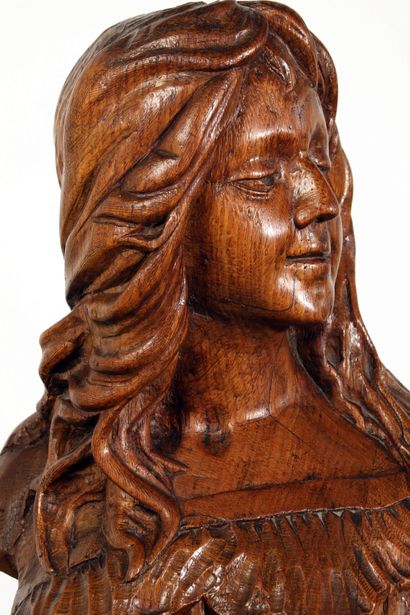 null 
Bust of young woman in carved wood representing Suson.
Carved inscription in...