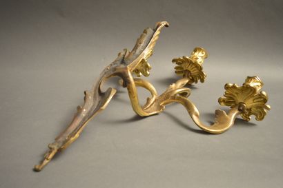 null Beautiful pair of ormolu sconces in the Louis XV style with three arms of lights....