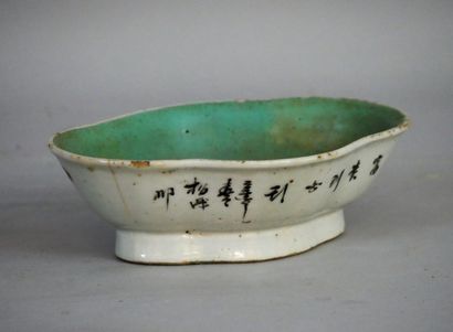 null A small polychrome earthenware bowl decorated with peonies and birds. China...
