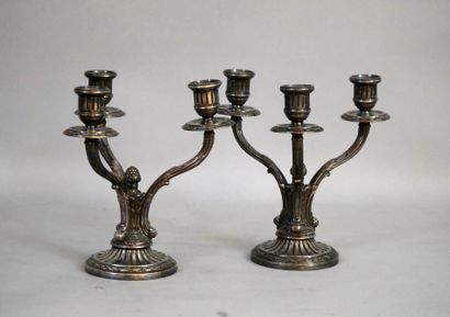 null A pair of silver plated bronze candlesticks with three branches. Height : 21...