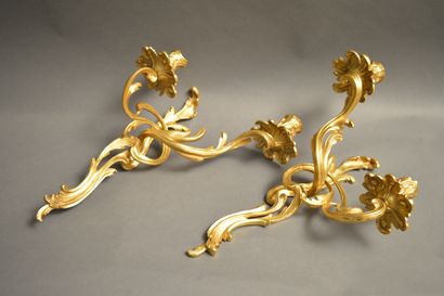 null A pair of ormolu sconces in the Louis XV style with two arms of lights. Period...