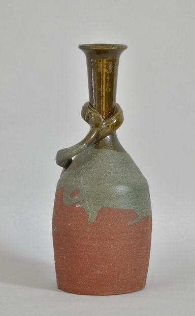 null Glazed terracotta bottle with red and green enamel decoration in the lower part...