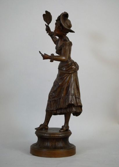 null Regula subject representing a woman with a hat, probably a singer, holding in...