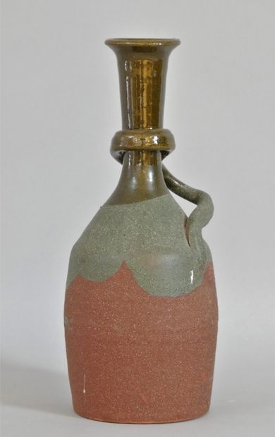 null Glazed terracotta bottle with red and green enamel decoration in the lower part...