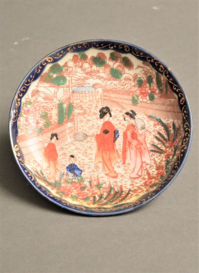 null Porcelain dish with polychrome decoration of women holding fans and children

children...