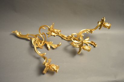 null A pair of ormolu sconces in the Louis XV style with two arms of lights. Period...